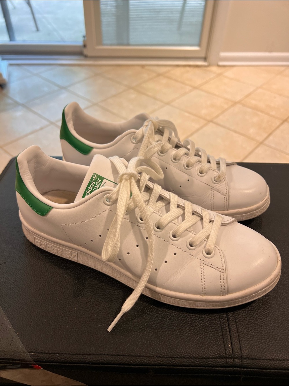 Adidas Stan Smith sneakers with a signature green heel cap
